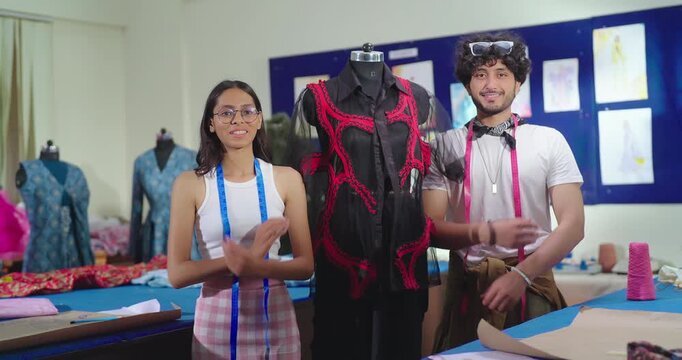Indian young adult gen z male man female wear tape around cross arms look camera standing at class room happy teen boy girl fold hand staring cam do pose learn new cloth craft course day college place