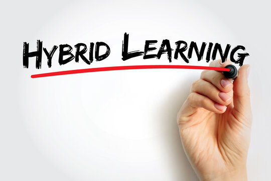Hybrid Learning written in bold brush font with a red underline, symbolizing modern education and online classroom concept. Hand holding marker emphasizing hybrid study approach