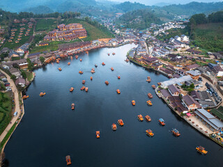 Traditional Chinese-style, tourist boats in dam or lake at Baan, Rak, Thai, Village Mae Hong Son, Thailand.