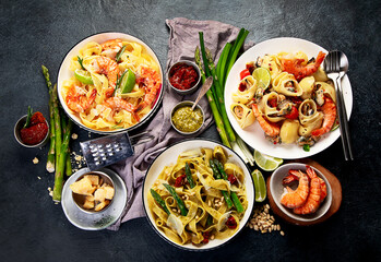 Italian dinner table with assortment of pastas.