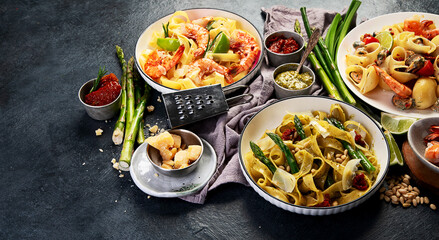 Italian dinner table with assortment of pastas.