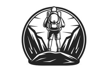 Black and white shows a person with backpack standing atop the mountain