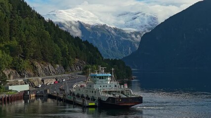 Aerial capture of ship in Storfjord fjord backed by Norwegian mountains