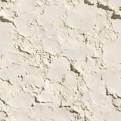 Obraz premium A close up shot reveals a textured surface of pale cream colored powder with shadows in bright sunlight.