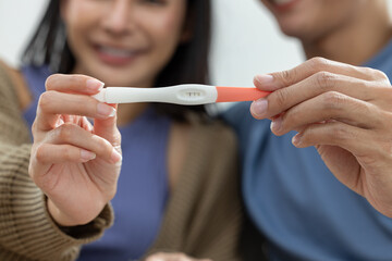 Couple Holding Positive Pregnancy Test