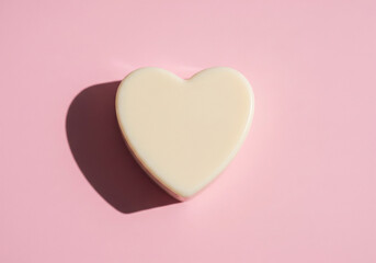 Creamy Heart Shaped Soap with Shadow on a Pink Background