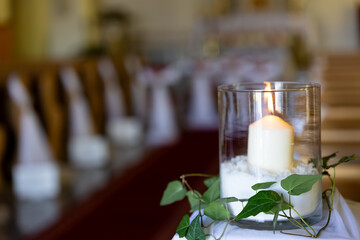 a decoration candle in the church before wedding ceremony