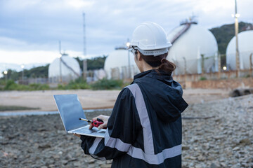 Engineer Monitoring Data at Natural gas plant