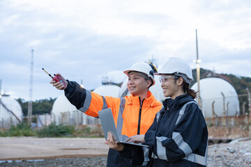 Engineers Discussing Operations at Gas Facility