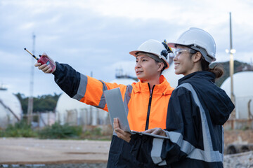 Engineers Discussing Operations at Gas Facility