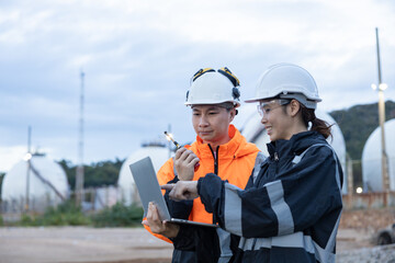 Engineers Discussing Operations at Gas Facility