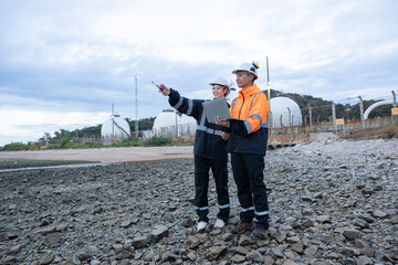 Engineers Discussing Operations at Gas Facility