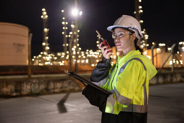 Engineers Conducting Night Inspection at Refinery
