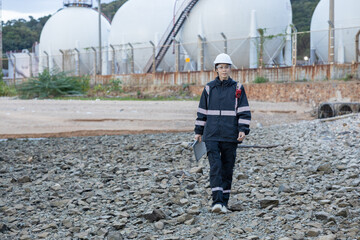 Engineer Monitoring Data at Natural gas plant