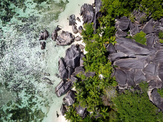 Anse Cocs beach, La Digue Seychelles, tropical beach during a luxury vacation in Seychelles. Tropical beach Anse Cocs beach, La Digue, Praslin, Mahe Seychelles with turqouse colored ocean