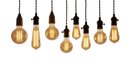 Collection of various vintage edison light bulbs with glowing filaments hanging against a dark background