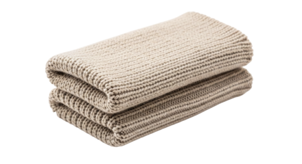 Folded beige knitted towel, a soft and cozy accessory for your home or spa, offering comfort and style