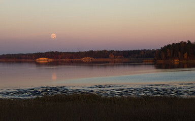 full moon, sunset over the river, autumn landscape