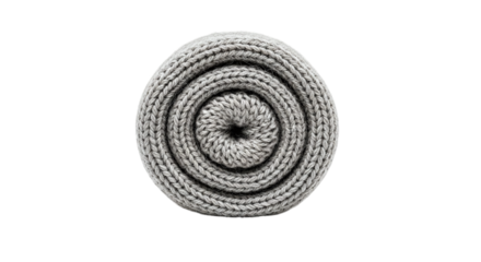 A tightly rolled gray knit blanket, forming a cozy and inviting spiral shape, perfect for warmth and comfort
