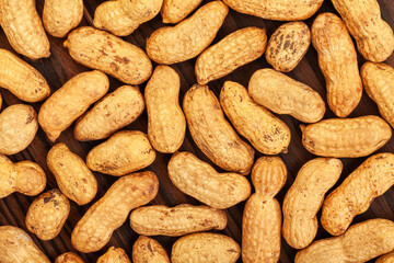 peanuts texture on wood background top view