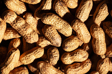 peanuts texture on black background top view