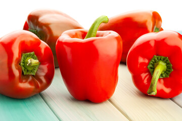 bell pepper on blue wood background on white