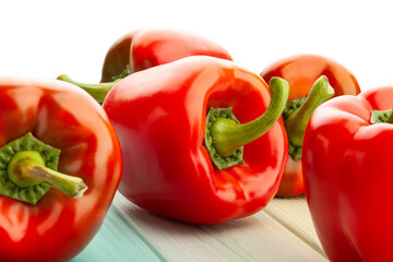 bell pepper on blue wood background on white