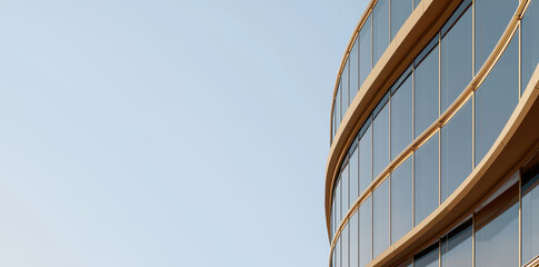 Modern architecture featuring a curved glass facade with golden frames under soft daylight. Clean, minimal, and elegant building design perfect for business, real estate, or architectural projects.