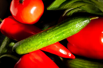 sliced cucumber vegetable mix on black background