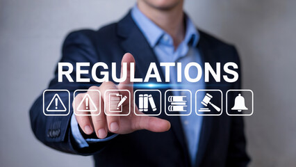 Professional businessman navigates digital regulations and compliance icons, symbolizing legal and business order.