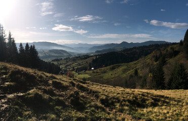 Beautiful amazing natural landscape in the mountains of Ukraine. Travel the world, discover wild locations. Protect the environment movement. Sunrise dawn in the foggy misty mountains.Autumn fall walk