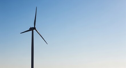 Fototapeta premium Wind Turbine Standing Tall in Clear Blue Sky During Daytime