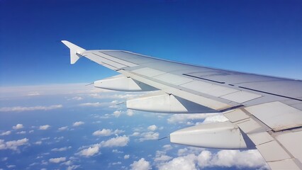 Obraz premium Minimalist Airplane Wing Over Clouds