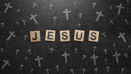 Fototapeta premium Christian cross and wooden cubes with Jesus text on a black background. Concept of Christianity, religious, faith, Jesus, or belief