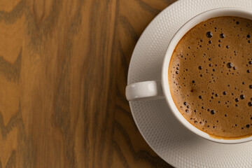 Close Up White Cup of Hot Cappuccino on Wooden Table