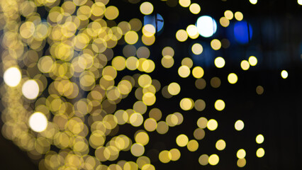 Bright gold sparkles and glowing lights, along with colorful decorations, glitter and bokeh, create a festive, sparkling and fun holiday atmosphere.