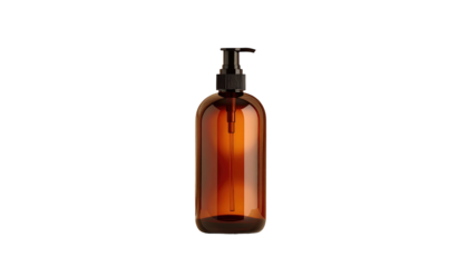 A tall, brown transparent bottle with a black pump dispenser is isolated against a black background. The bottle appears full