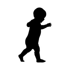 Silhouette of a baby learning to walk