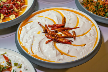 Mediterranean cuisine, olive oil, healthy and delicious salad varieties with green vegetables.Vegetarian and vegan healty food, open buffet in a luxury hotel. Meze varieties, salad bar.