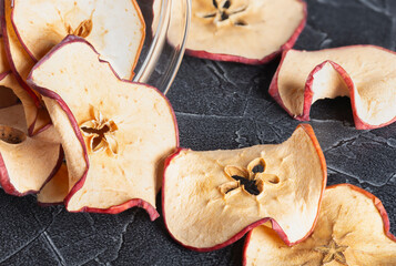 large round dried apple chips in a jar