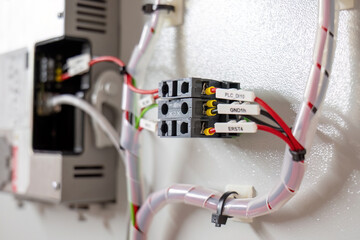 Wired industrial relay module with labeled connections

