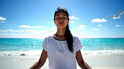 Woman Meditating in Lotus Pose on Beach With Ocean View