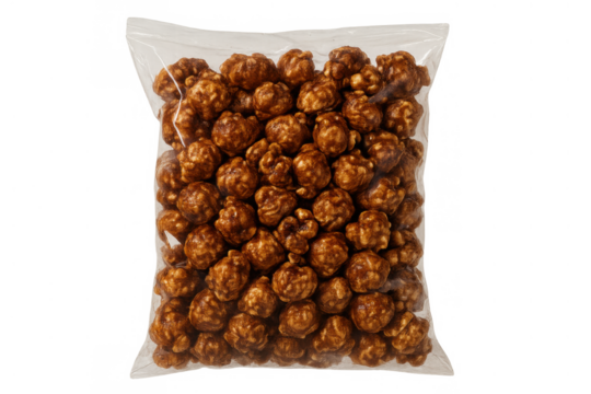Caramel popcorn in a clear plastic bag, sweet dessert snack for movie nights, party treats, and leisure time