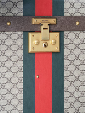 Luxury hard-shell suitcase by Gucci, with a design that combines GG Supreme fabric and green and red Web ribbon.Milan - Italy,24 October 2025
