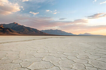 Panoramic dry lakebed leading to distant mountains