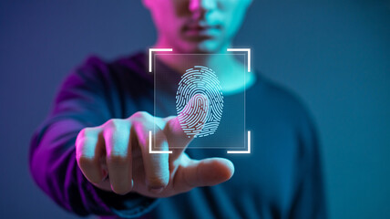 Man touches screen for fingerprint scan with futuristic glow