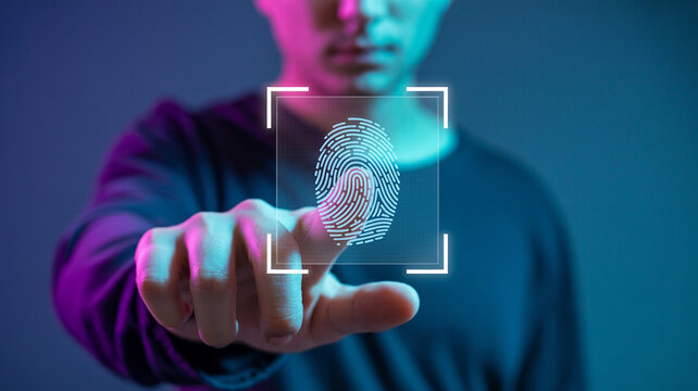Man touches screen for fingerprint scan with futuristic glow