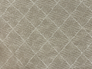 Fototapeta premium Close up of fabric with diamond pattern, in grey and beige color. Suitable for fabric, upholstery, drapery, cloth, or wallpaper. Seamless background texture.