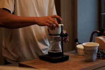 Barista making pour-over coffee