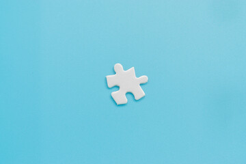 Single jigsaw puzzle on light blue background